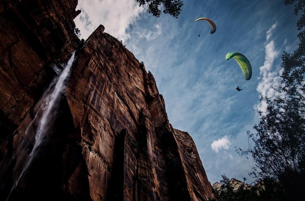 Free Image of Paragliding over a waterfall - Extreme sports illustration 