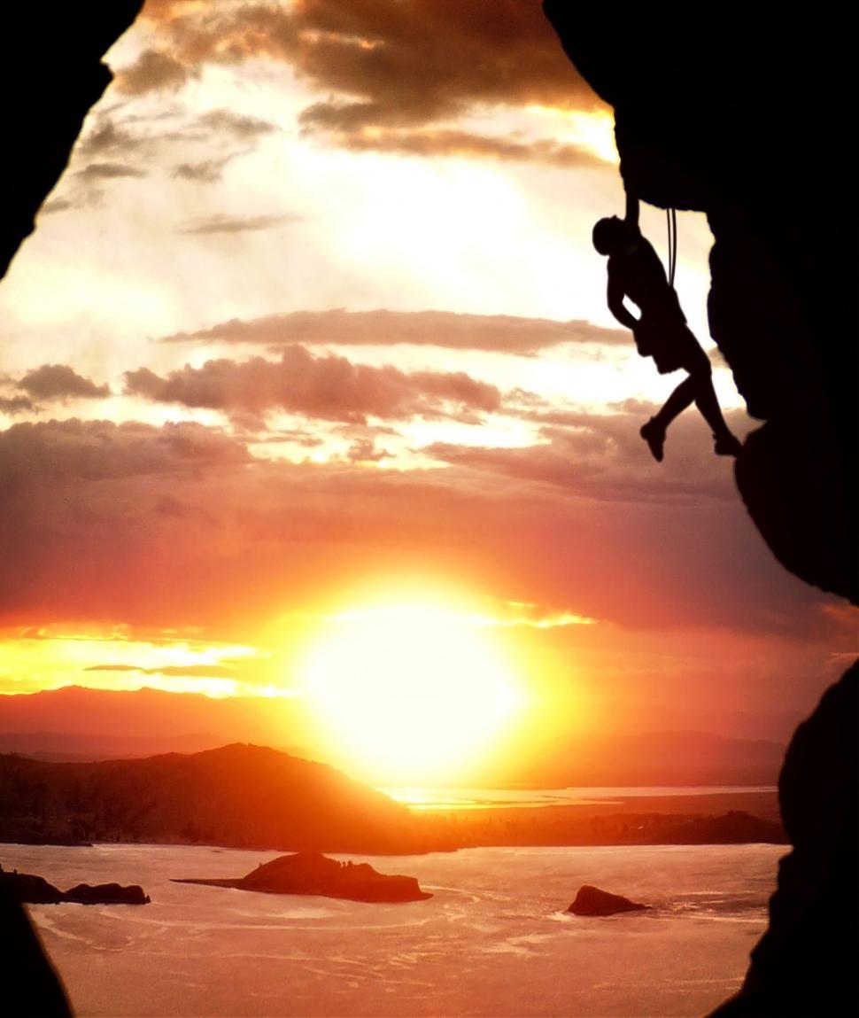 Free Image of Free-climber rising at sundown 