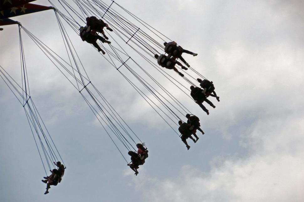 Free Image of People riding on swing ride 