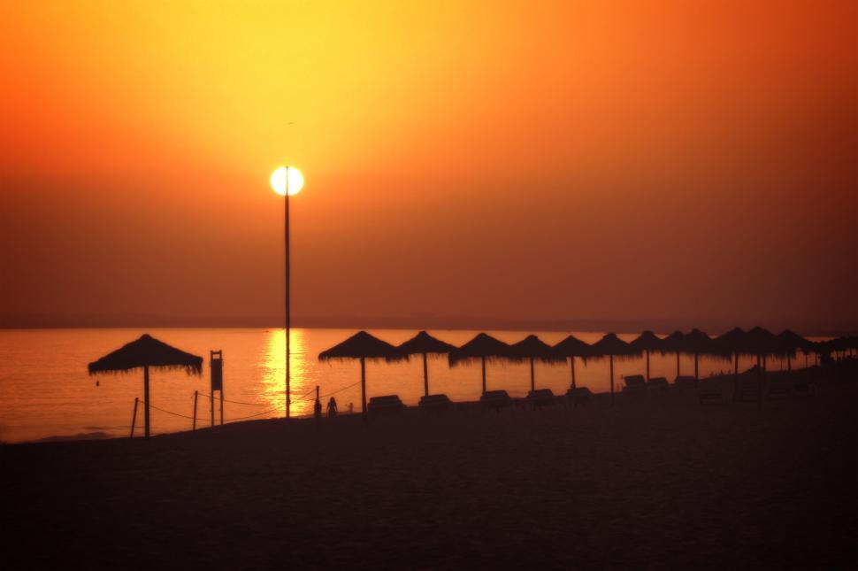 Free Image of Sun on a stick - A fiery sunset in Vale do Lobo beach, Algarve,  