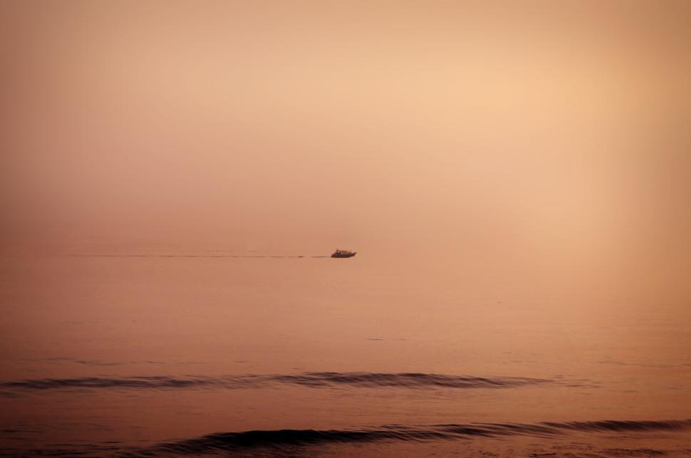 Free Image of Floating - A lonely distant boat cruising the horizon 