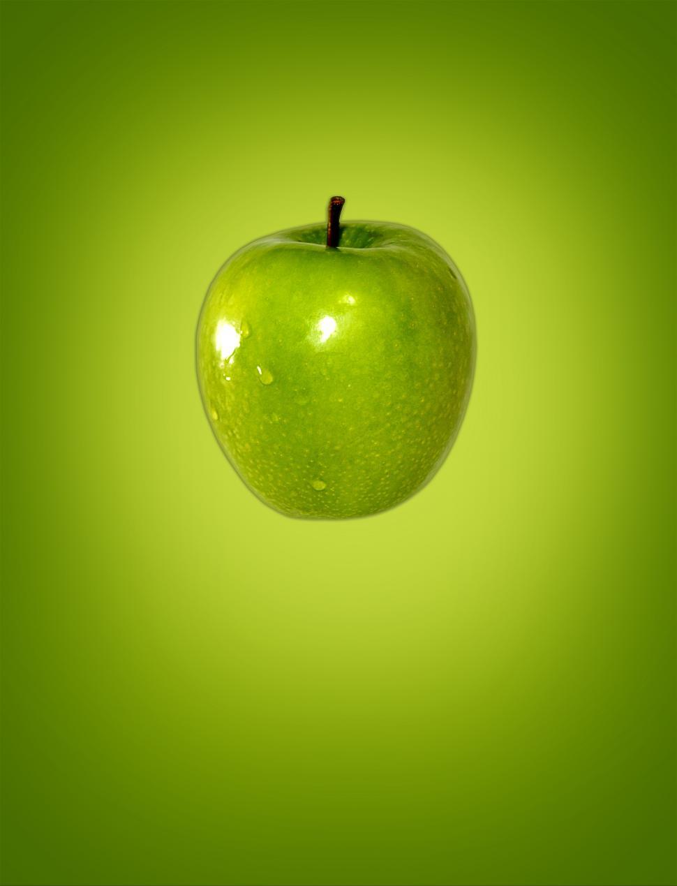 Free Image of Green apple on green background 