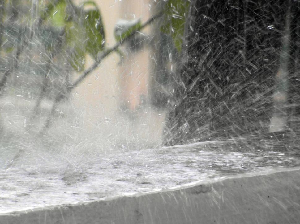 Free Image of Rain Splashing Off a Wall  