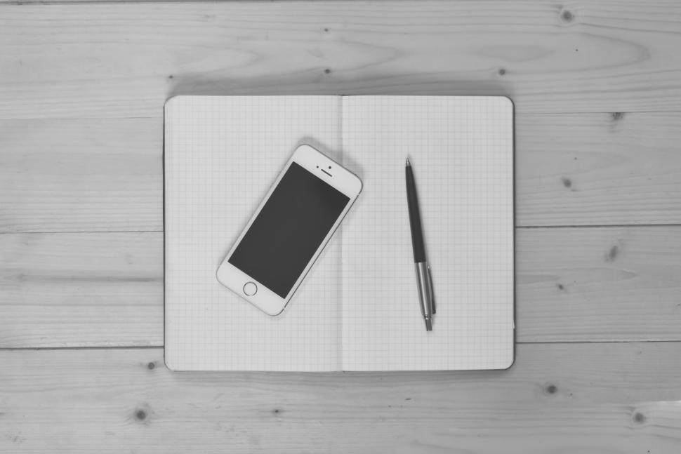 Free Image of Mobile phone and notebook 