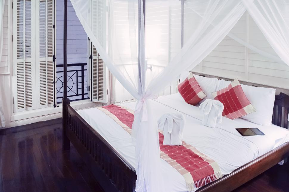 Free Image of Hotel room bed with ipad 