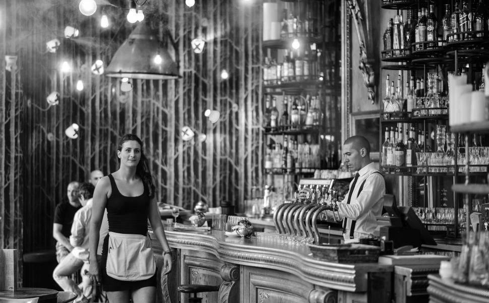 Free Image of Black and white photograph of a bar counter 