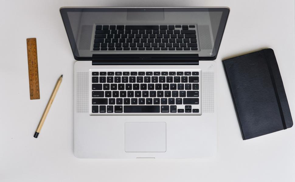 Free Image of Flat lay of laptop computer and tools 