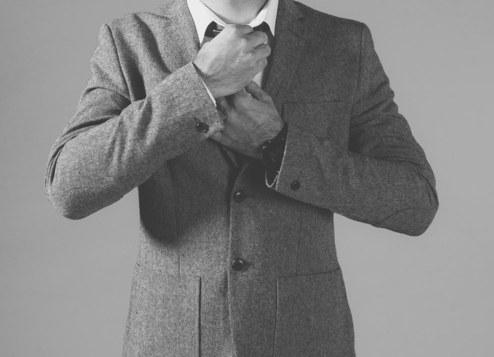 Free Image of Businessman dressing up for work 