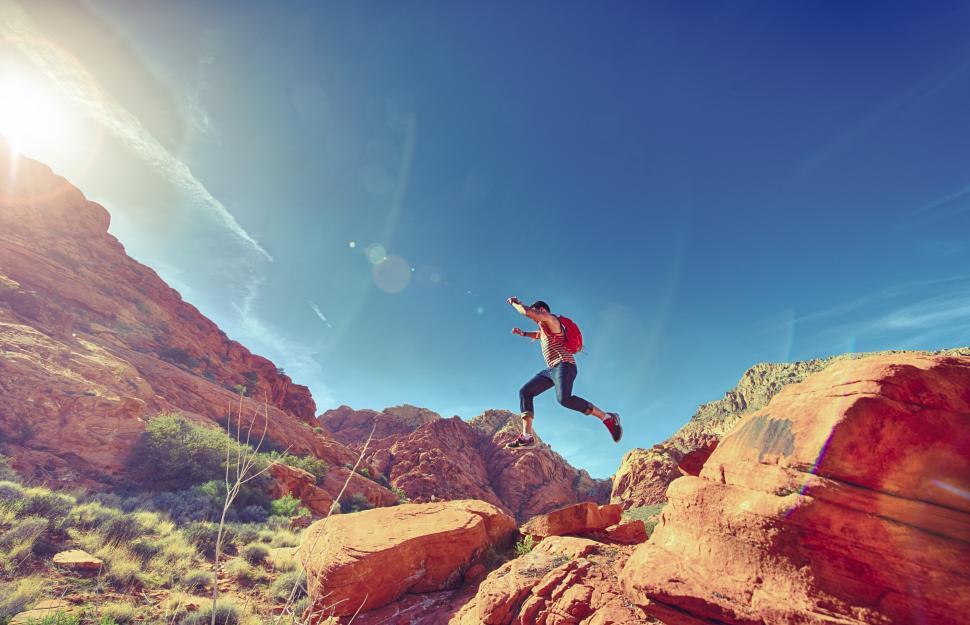 Free Image of Man jumping on rocks 