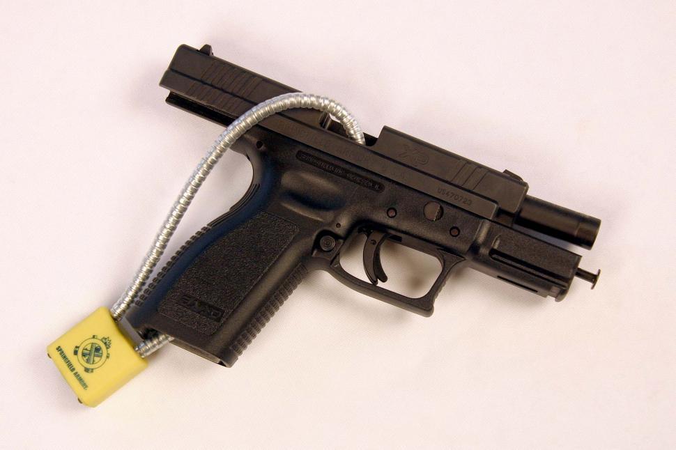 Free Image of 9mm Handgun with cable lock 
