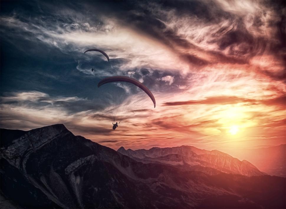 Free Image of Into the atmosphere - Paragliding over mountain ridge 