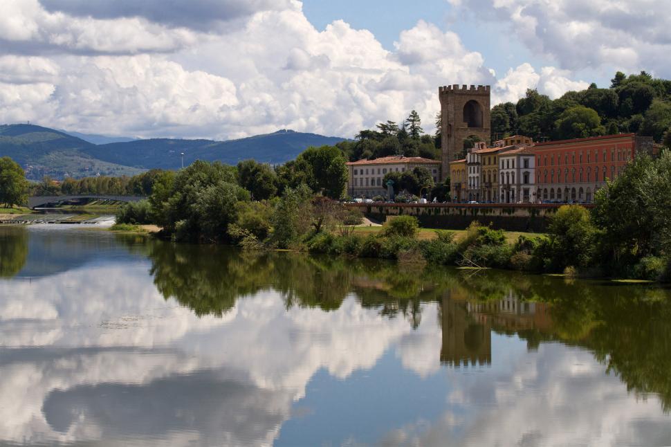 Free Image of Piazza Giuseppe Pozzi reflecting in the Fiume Arno  