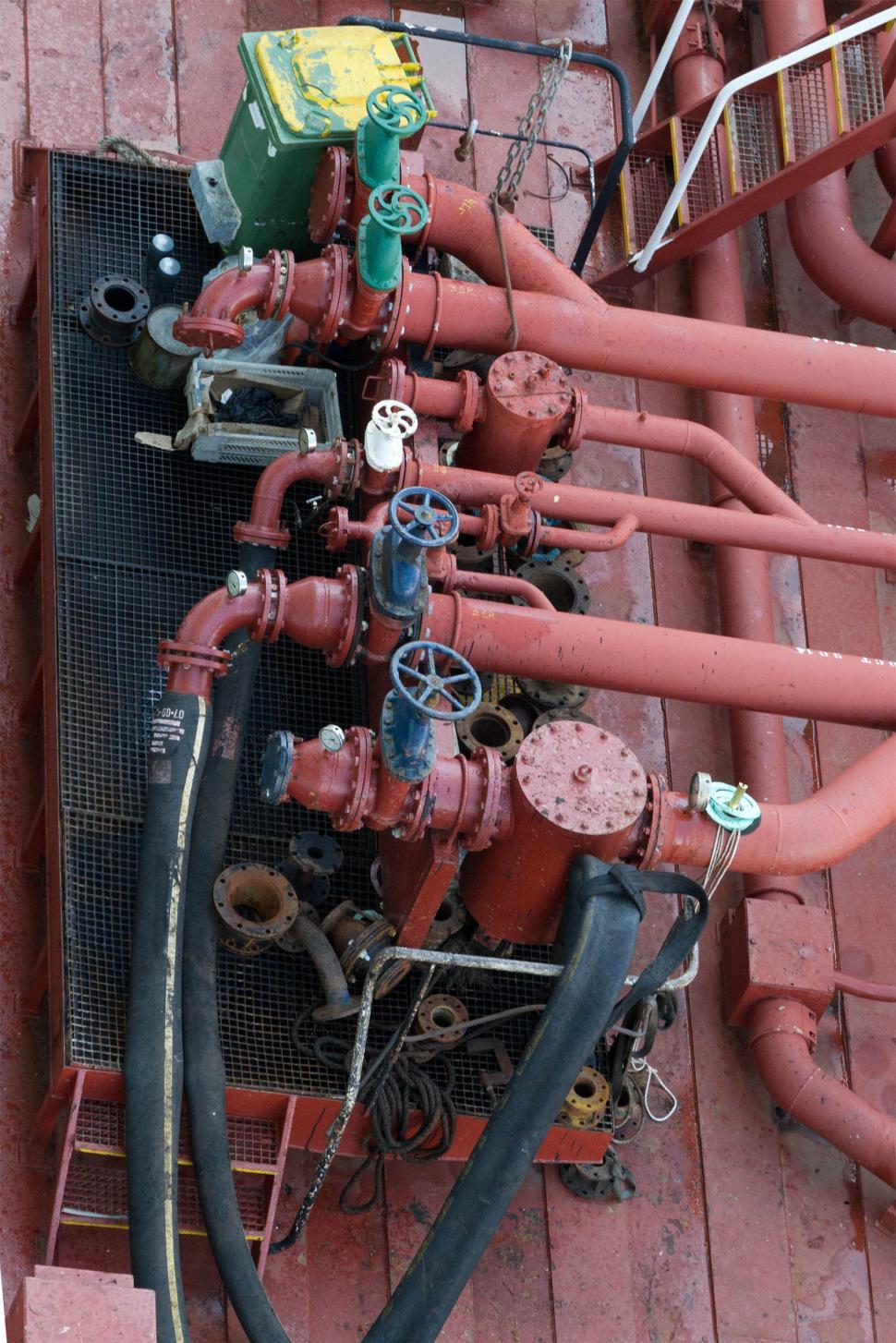 Free Image of Oil pipelines and Valves above Basin 