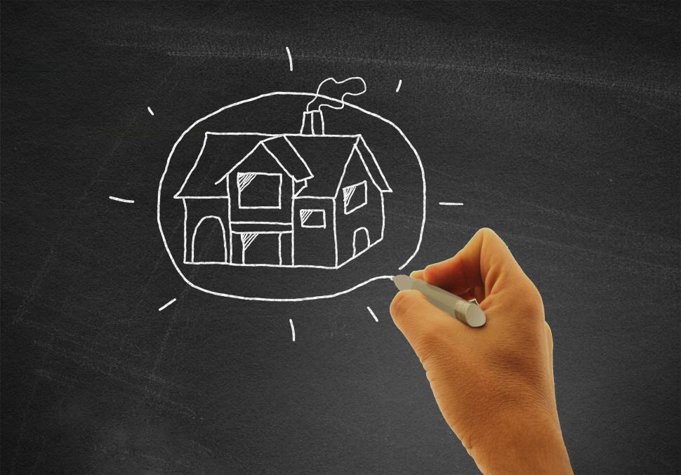 Free Image of Hand drawing a house on blackboard - Real estate and housing con 