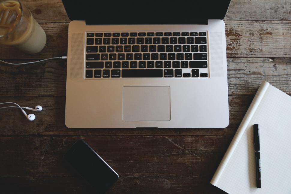 Free Image of Coffee, earbuds, computer 