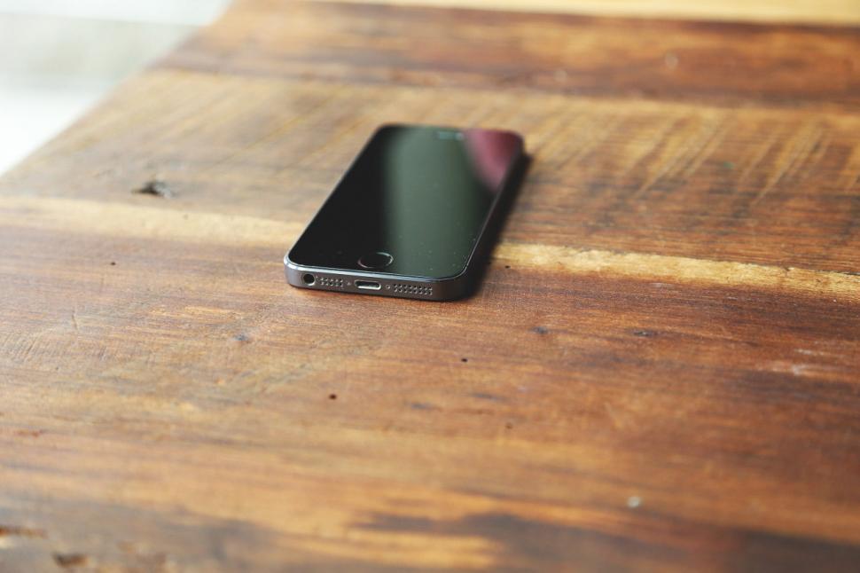 Free Image of Phone sits on table 
