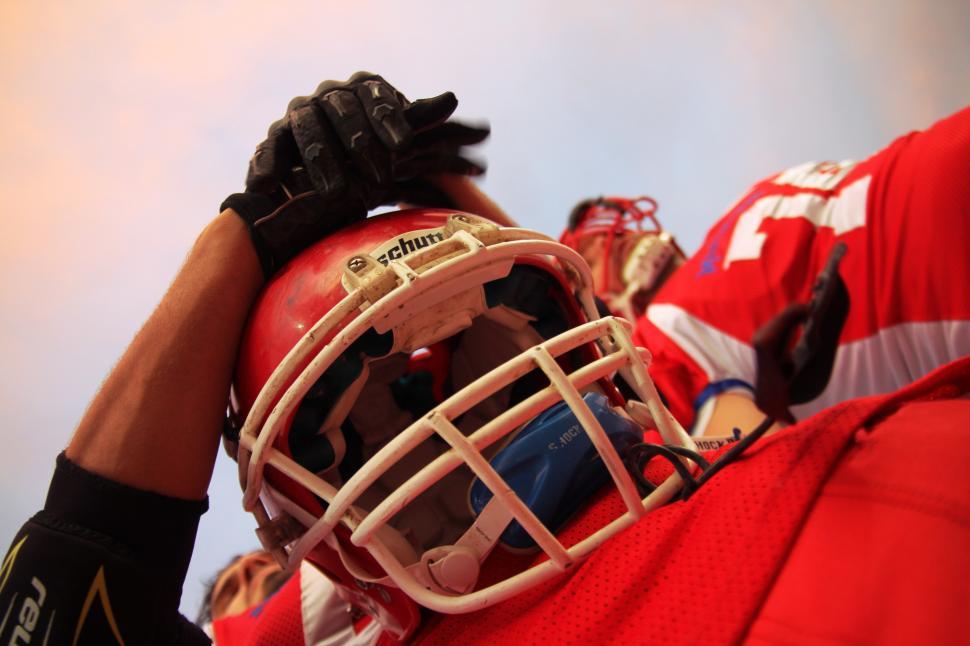 Free Image of Player holding football helmet 