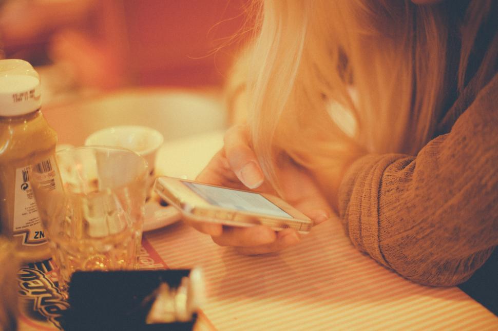 Free Image of Woman holding smartphone 