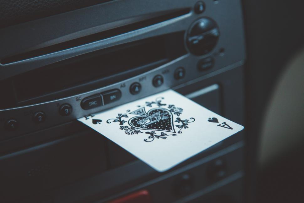 Free Image of Ace card sticking out of dashboard 