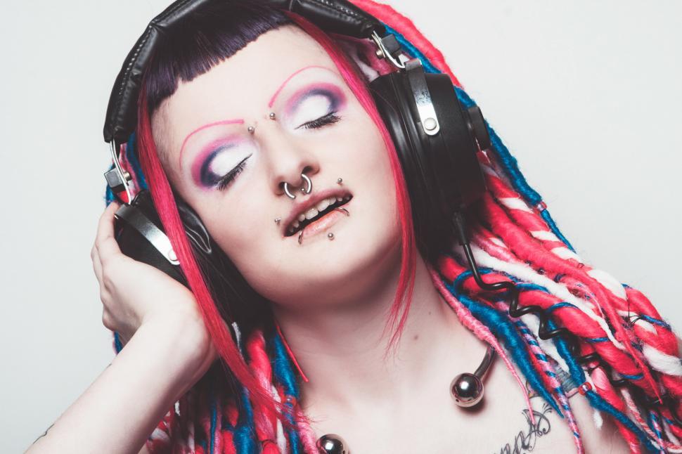 Free Image of Person enjoying music through headphones 