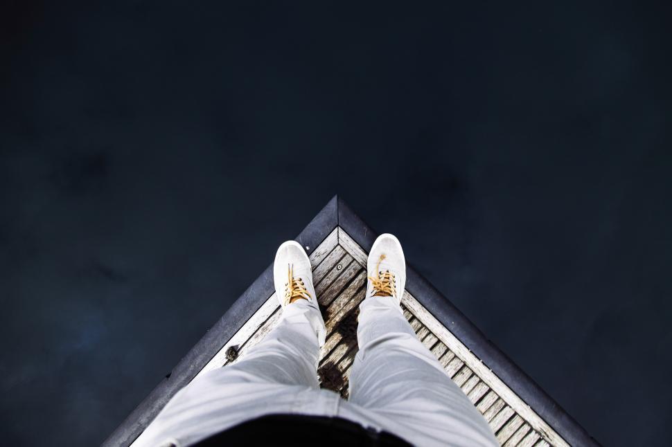 Free Image of Looking at own shoes 