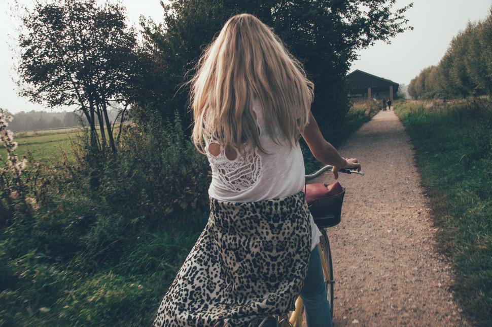 Free Image of Woman riding bicycle  