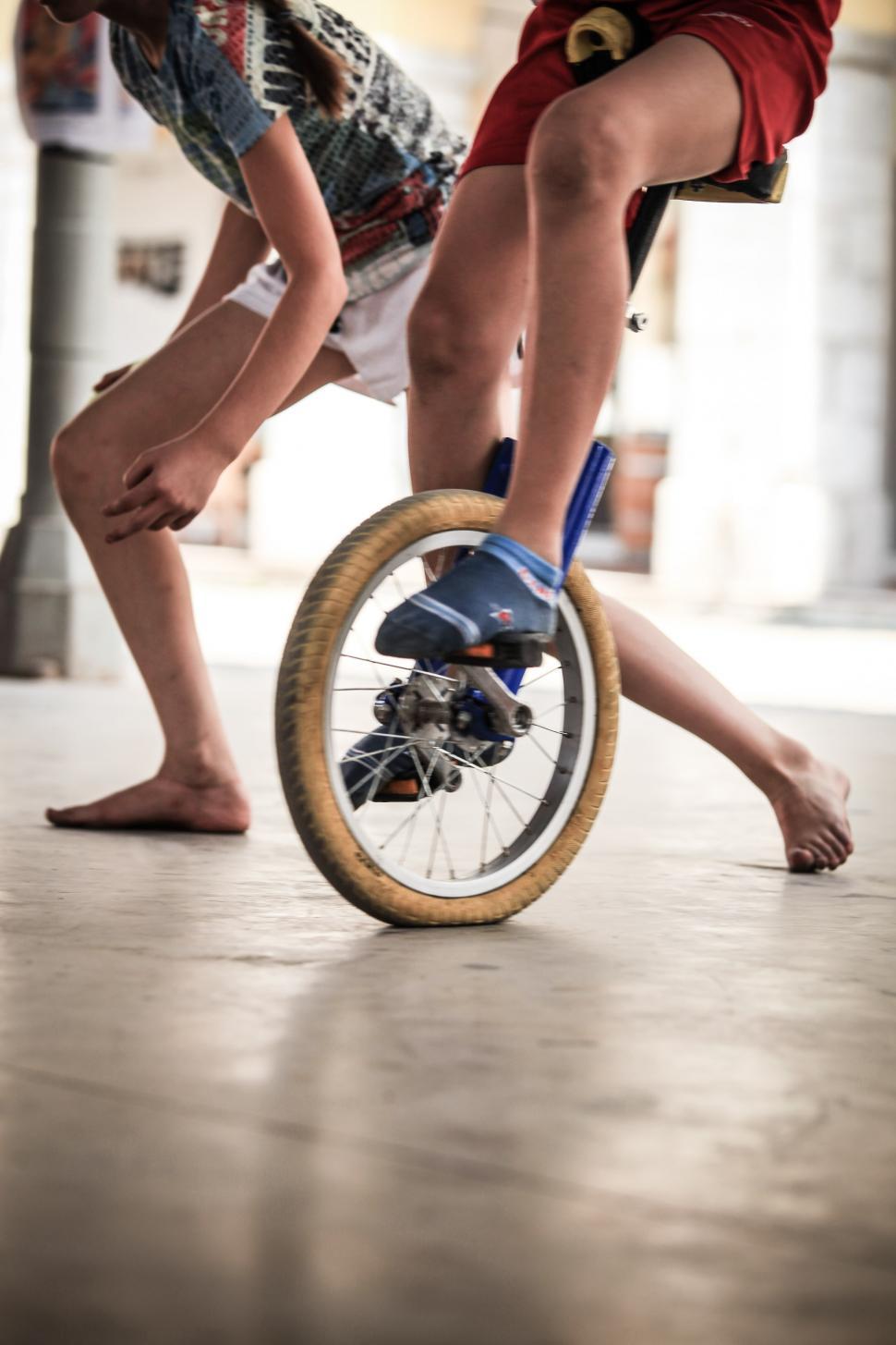 Free Image of Young boy riding a unicycle 