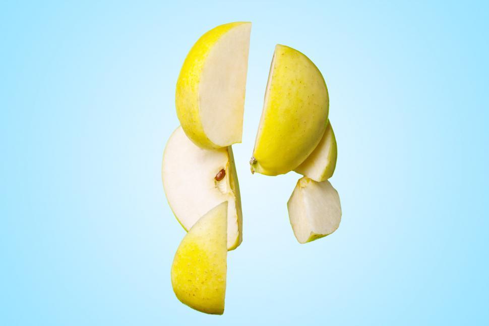 Free Image of Halved Apple on Blue Background 