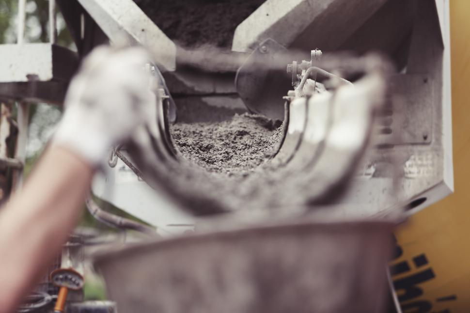 Free Image of Person Pouring Liquid Into a Bowl 