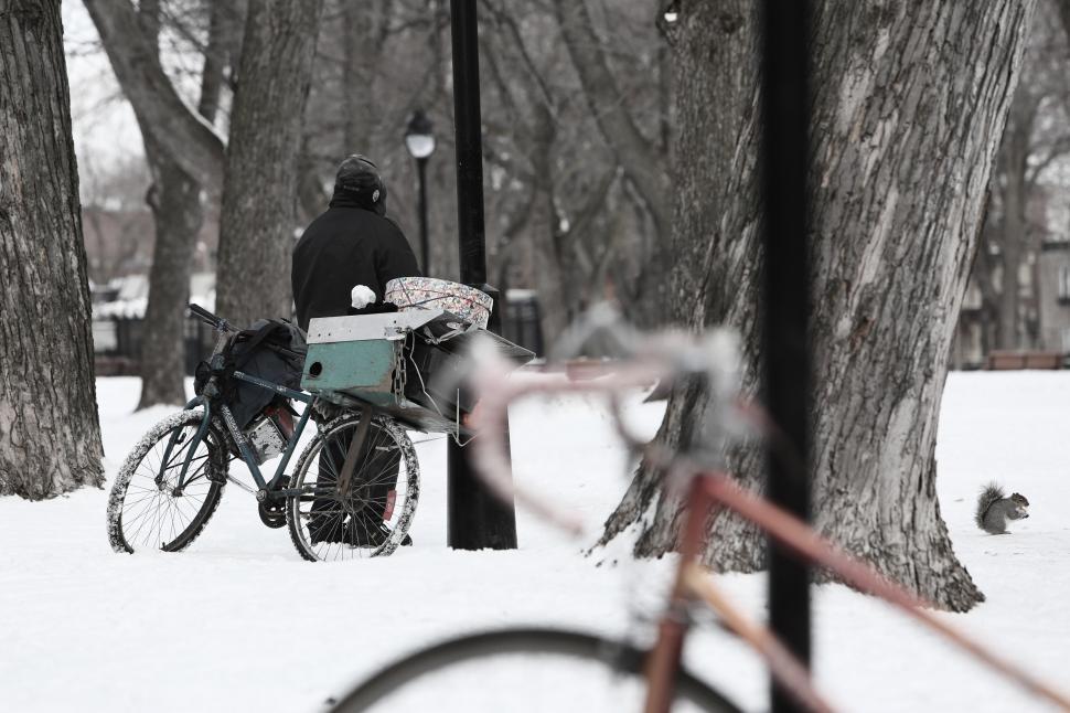 Free Image of Person Sitting on Bench in Snow 