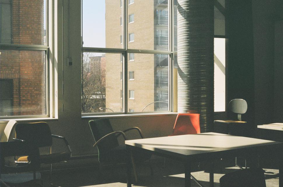 Free Image of Room Filled With Windows and Furniture 