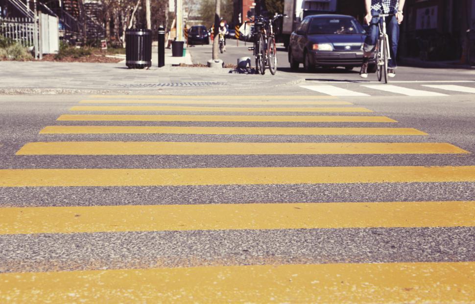 Free Image of Person Riding Bike on City Street 