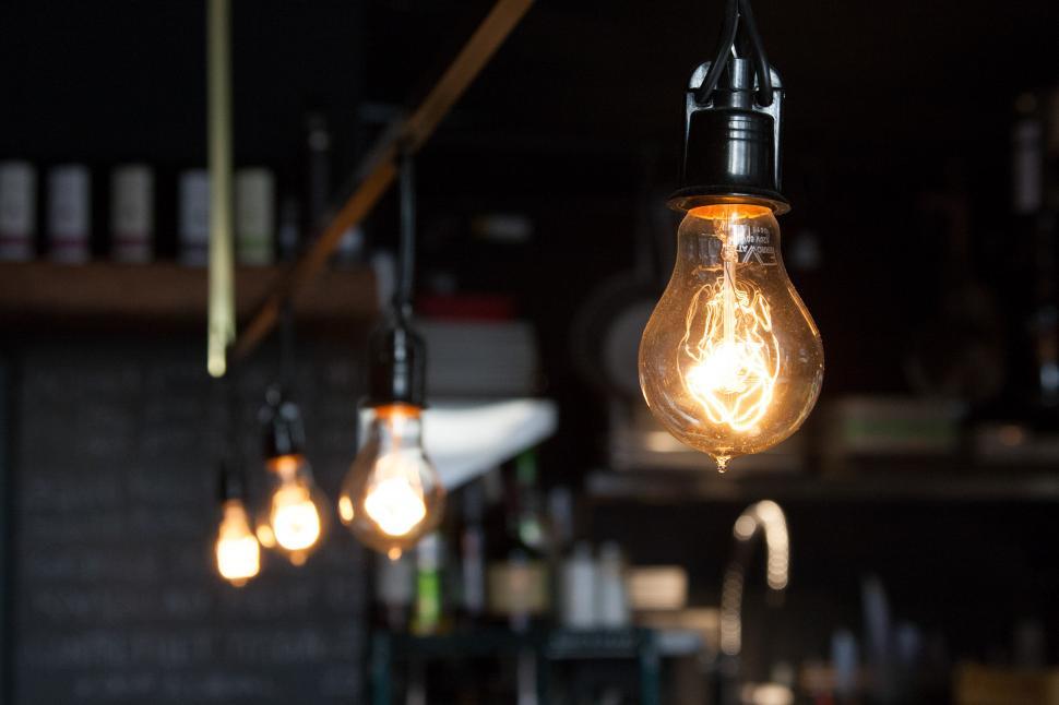 Free Image of Group of Light Bulbs Hanging From Ceiling 