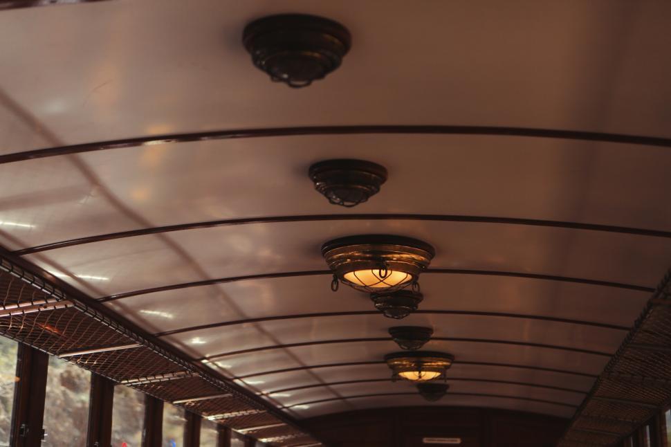 Free Image of Illuminated Hallway With Multiple Ceiling Lights 
