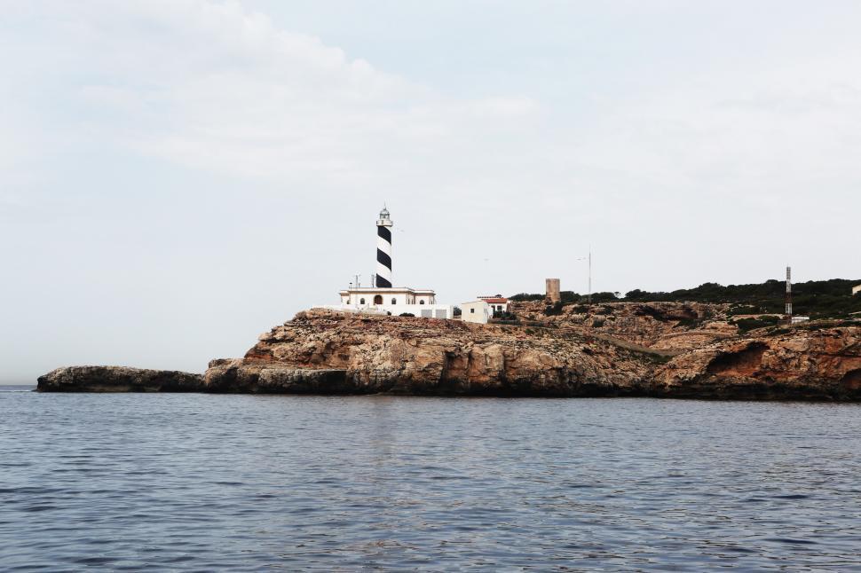 Free Image of Light House on Rocky Island 