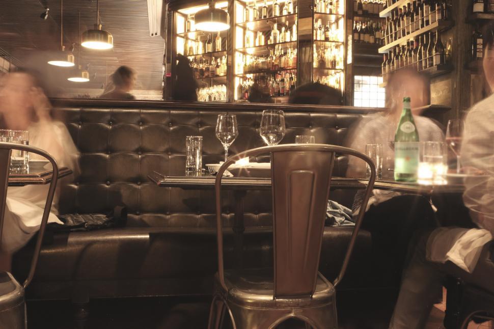 Free Image of Man Sitting at Table in Restaurant 