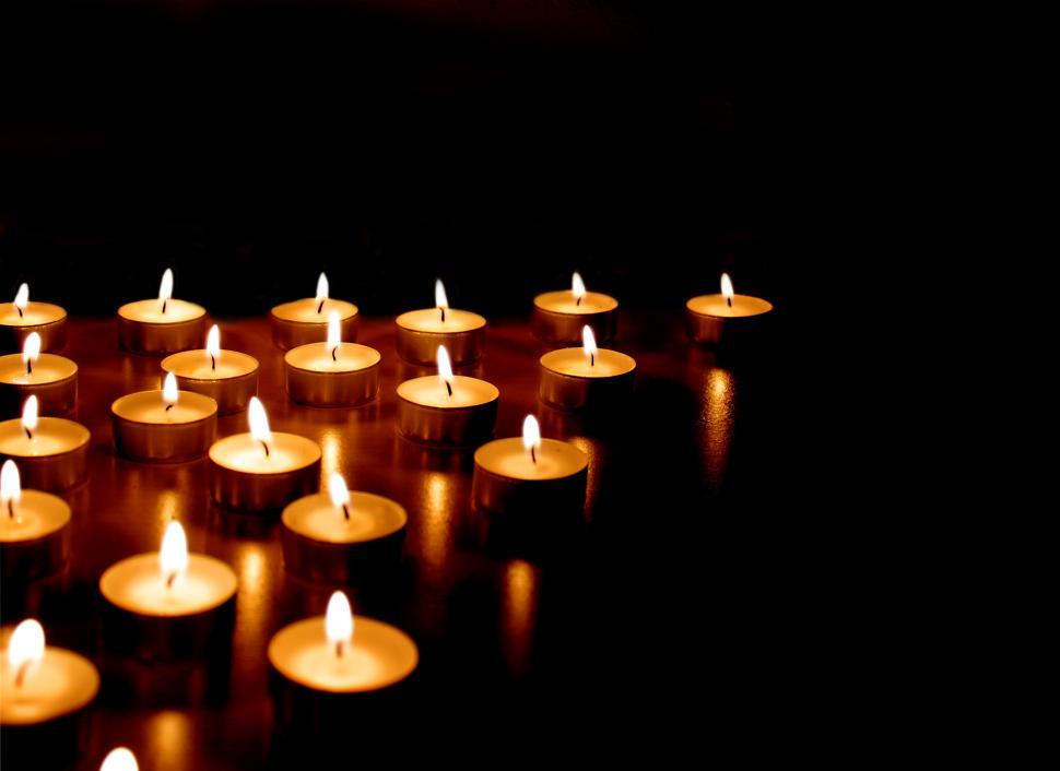 Free Image of Burning candles on black background 