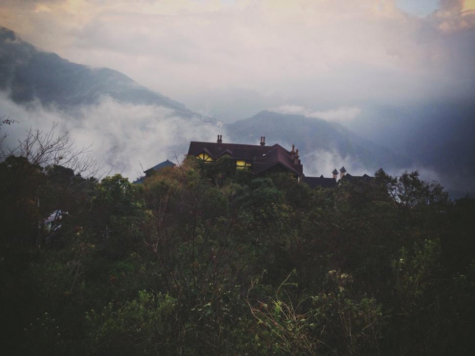 Free Image of House on Hill Surrounded by Trees 