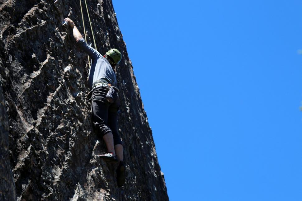 Free Image of Man Climbing Up Mountain 