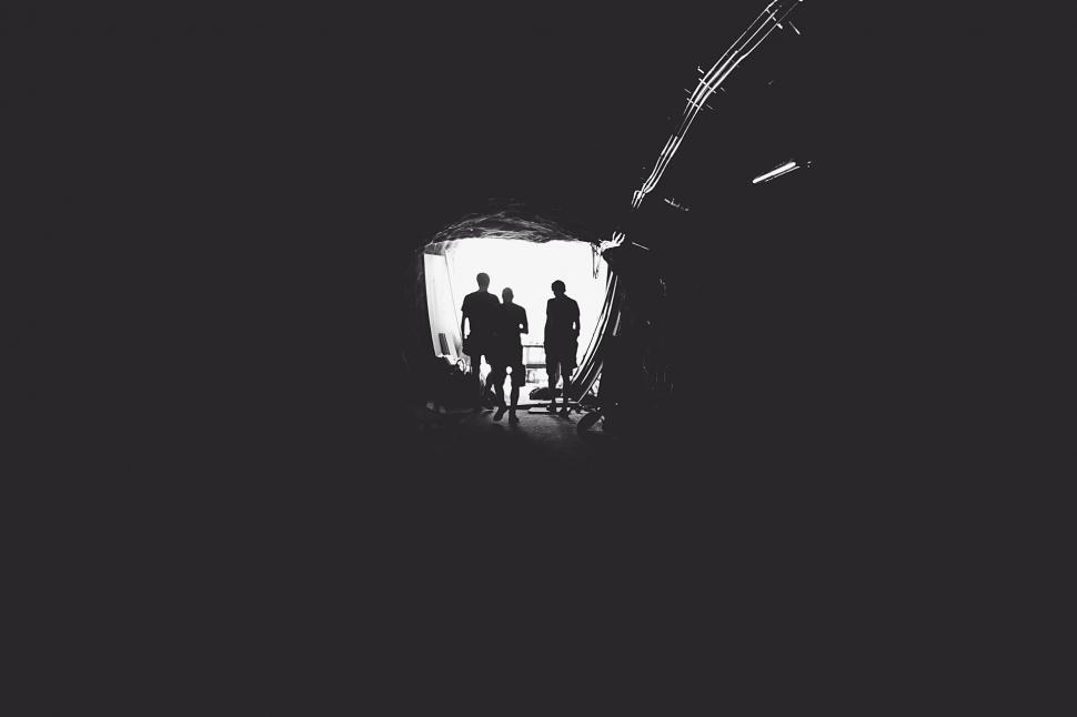 Free Image of Two People Standing in Front of Television 