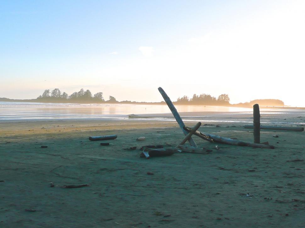 Free Image of Broken Fire Hydrant on Sandy Beach 