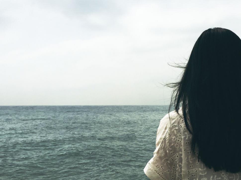 Free Image of Woman Observing Ocean From Boat 