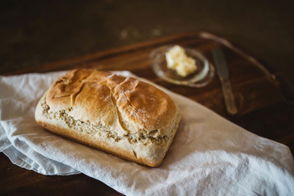 Free Image of Loaf of Bread on Top of Paper 