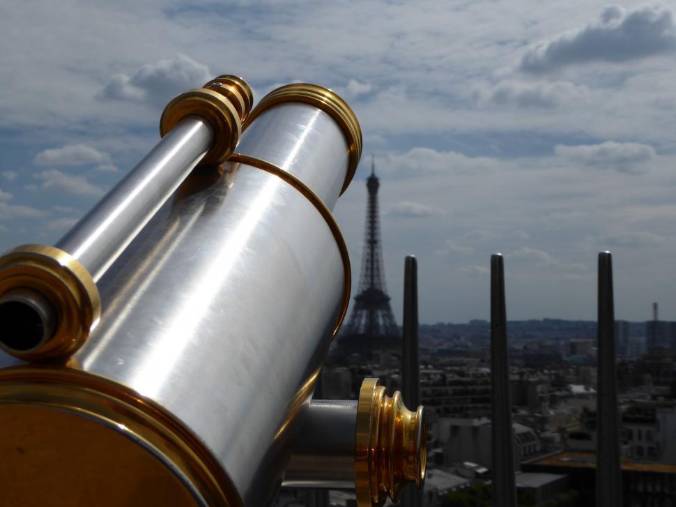 Free Image of Telescope Observing Cityscape From Building Rooftop 