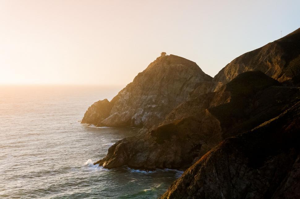 Free Image of Large Rocks by Body of Water 