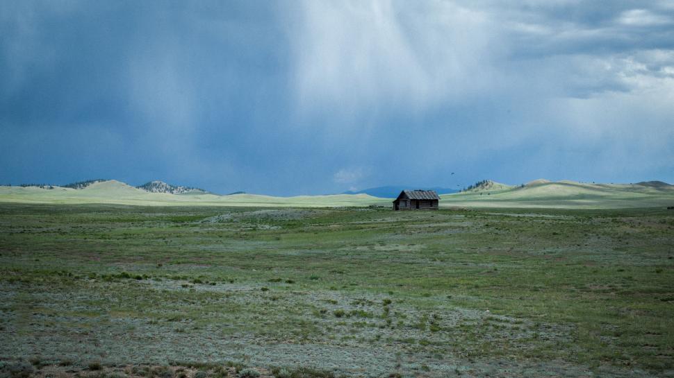 Free Image of A Lone House in the Middle of a Field 