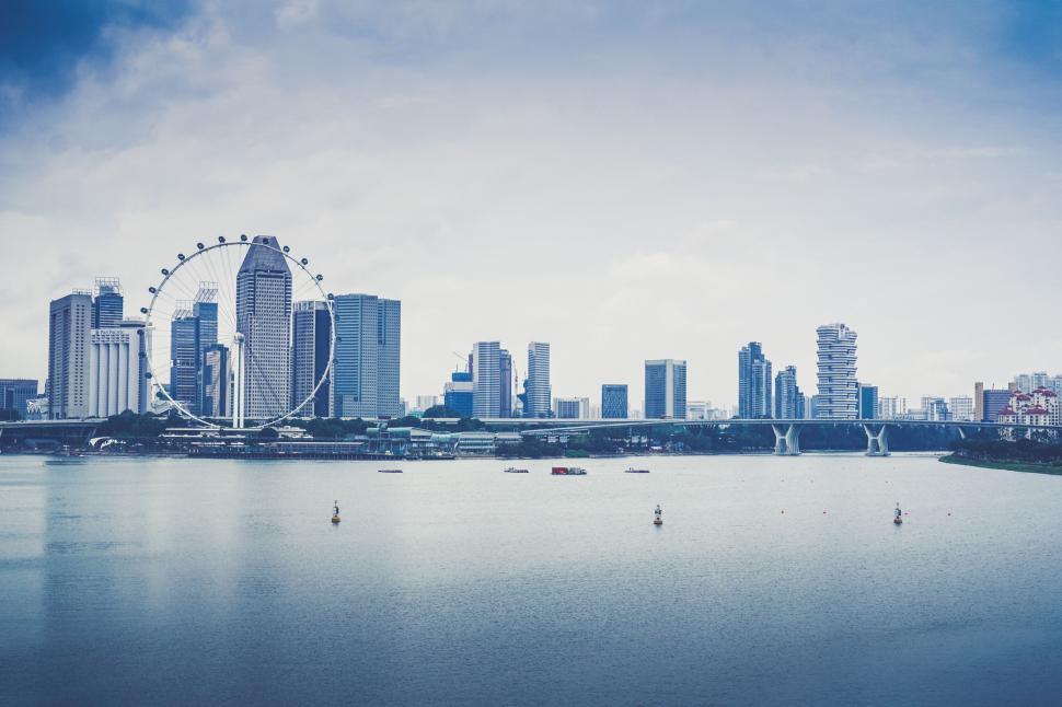 Free Image of City Skyline Overlooking Vast Body of Water 
