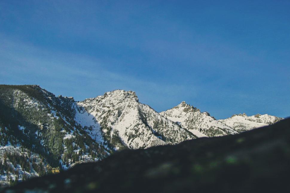 Free Image of Snow Covered Mountain Range Under Blue Sky 