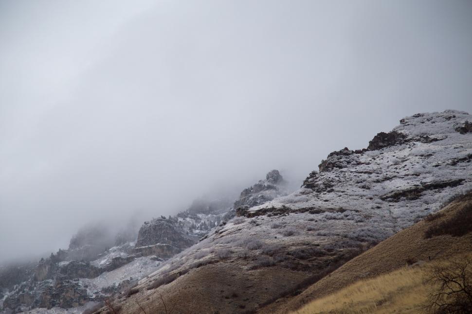 Free Image of Person Snowboarding on Snowy Mountain 