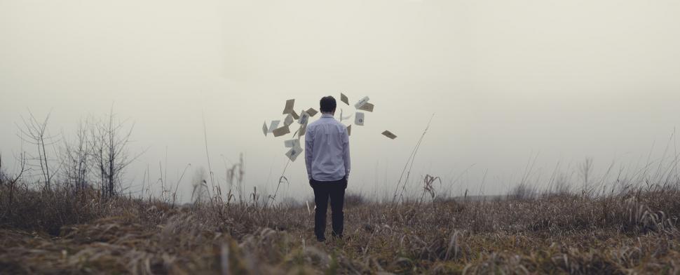 Free Image of Person Standing in Field With Kite 